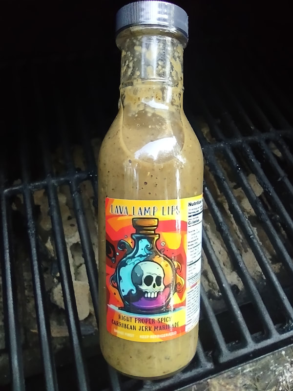 LAVA LAMP LIPS - Jerk marinade featuring local thyme, alliums, and chiles, plus allspice, ginger, and citrus. Bottle marinates 6 lbs protein. 12 fl oz.